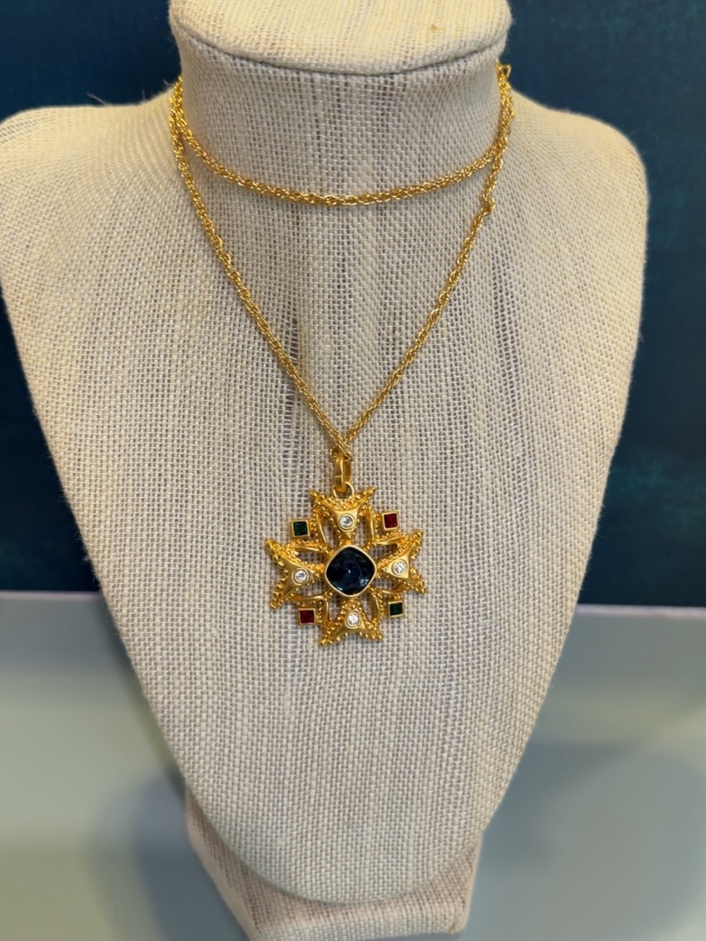 Vintage AVON gold toned jeweled Maltese cross pendant necklace in original box.